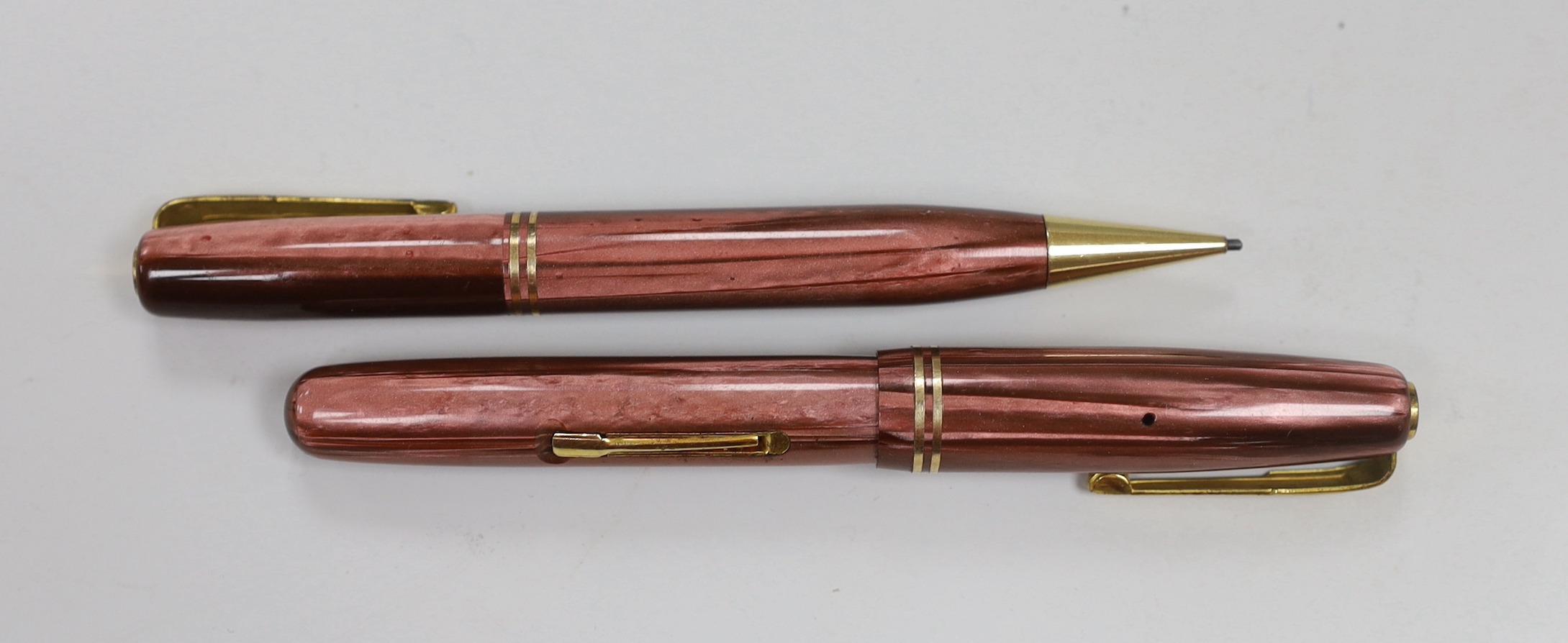 A boxed Waterman's pen and pencil Ladies Writing Set, comprising a pink striated model 512V and pencil in original card case